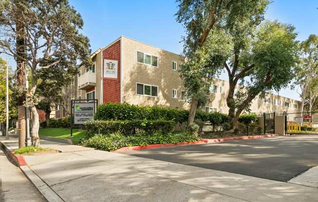 Pet Friendly Apartments in Marina Del Rey, CA - Exterior View of Casa De Marina Apartments with Lush Landscaping and Gated Entry