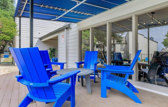 a blue bench in front of a building