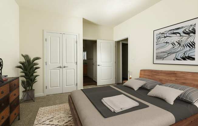 a bedroom with a bed and a painting on the wall at Aviara Flats, Arizona
