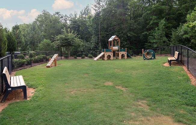 a backyard with a play yard and a playground