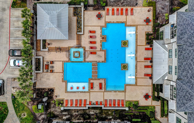 arial view of a large swimming pool in a residential yard