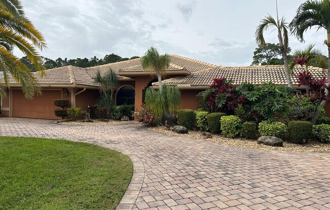 Tranquil Lakefront Living in the Heart of Port St. Lucie with Pool!