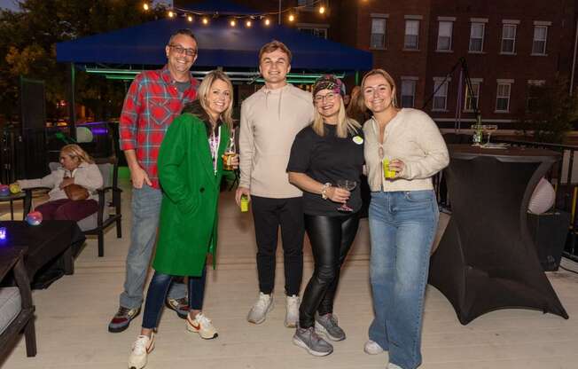 a group of people posing for a picture at a party