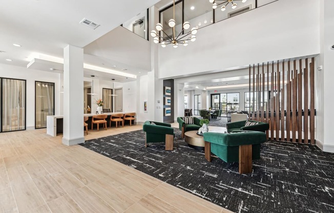 a large lobby with furniture and a large chandelier