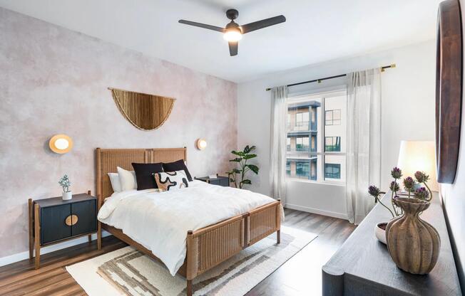 Sunlit and stylish, this bedroom at Modera Higley Commons blends natural warmth with refined design for a truly inviting retreat.