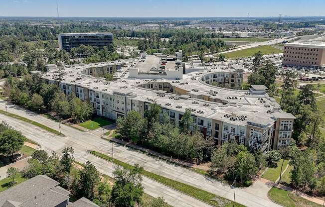 an aerial view of a city with buildings and trees