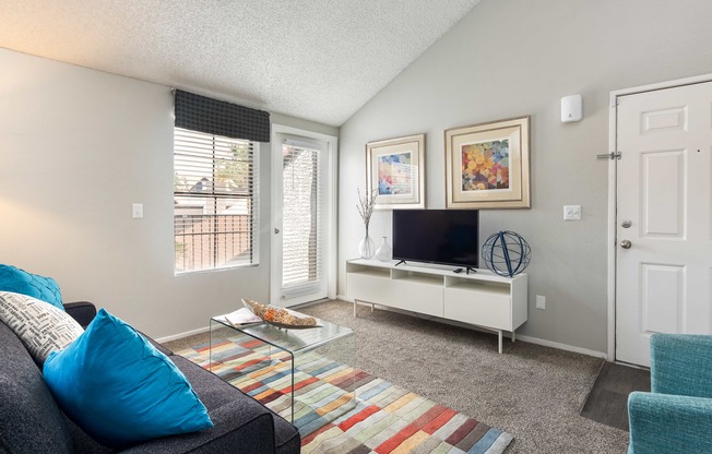 a living room with a couch and a tv