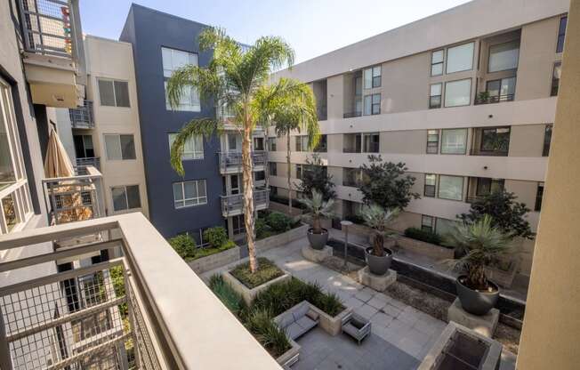 a view of the courtyard from the second floor balcony