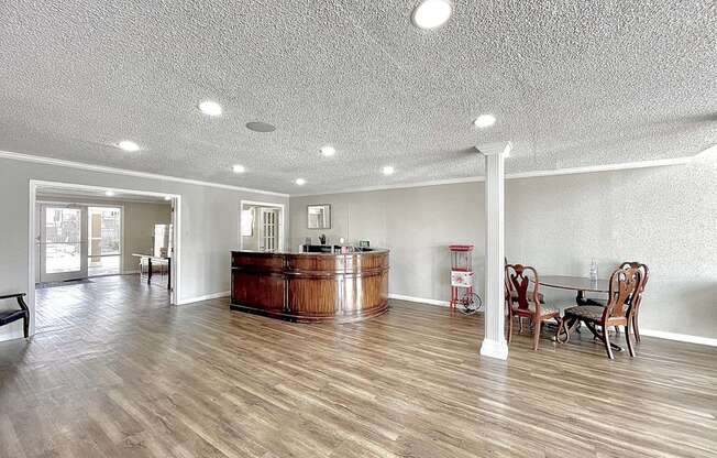 a large living room with a bar in the center at Cambridge Village Apartments, Houston, TX 77045 ? 