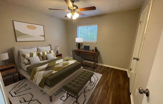 a bedroom with a large bed and a ceiling fan at The Junction, Memphis, TN, 38111