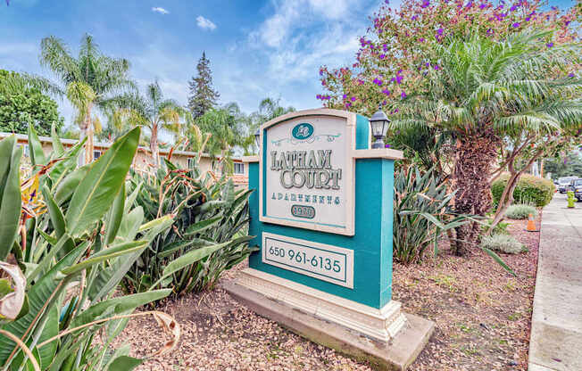 A sign for La Palma Country Club with a phone number on it.