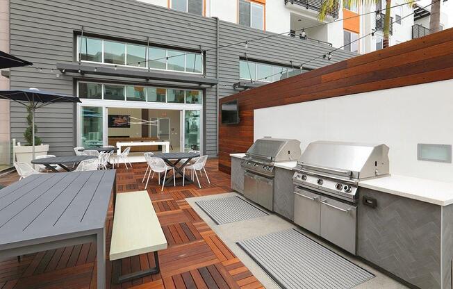 a patio with two stainless steel appliances on it