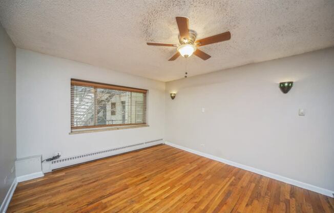 Large windows and rich hardwood flooring