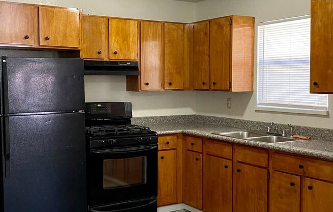 3 bedroom unit with private laundry. 2 OFF STREET PARKING SPOTS!