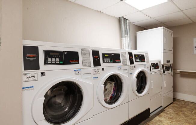 a row of washing machines in a laundromat