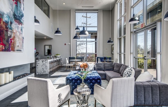 a living room filled with furniture and a large window