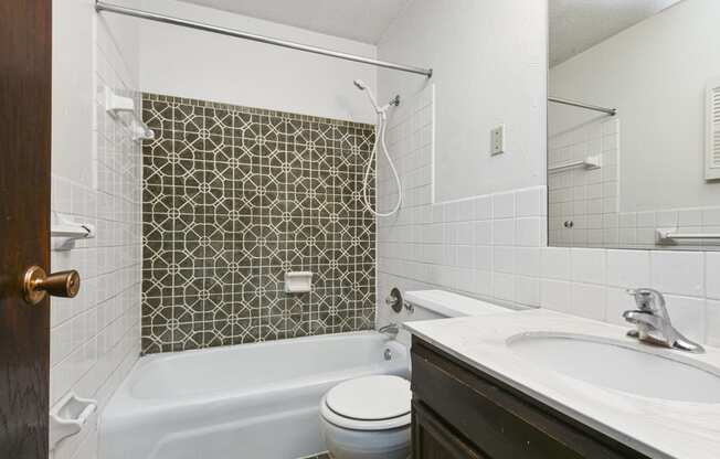 Fridley, MN Georgetown Apartments. A bathroom with a sink toilet and bathtub