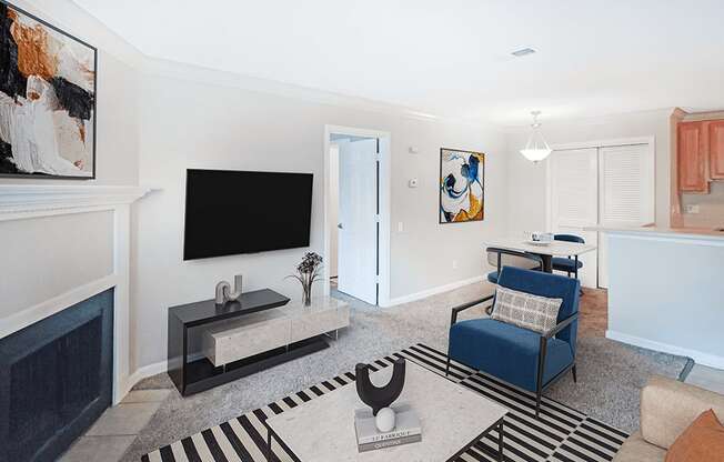 A living room with a blue chair and a television.