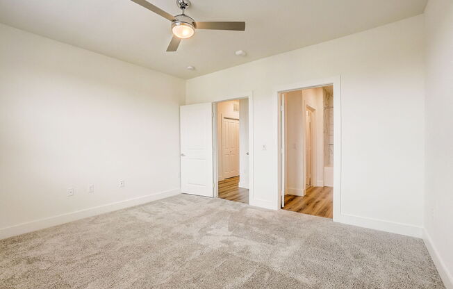 a spacious living room with carpet and a ceiling fan at Aurora Watson Branch, Mansfield, 76063