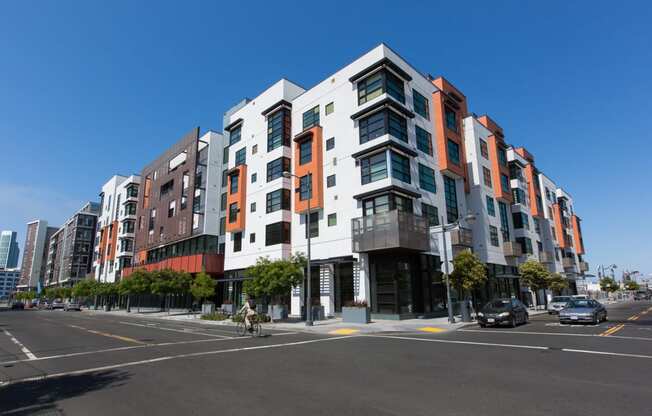 Luxury Apartments in San Francisco CA-Venue Apartments Street Corner View Of Exterior Of Complex Lined With Trees