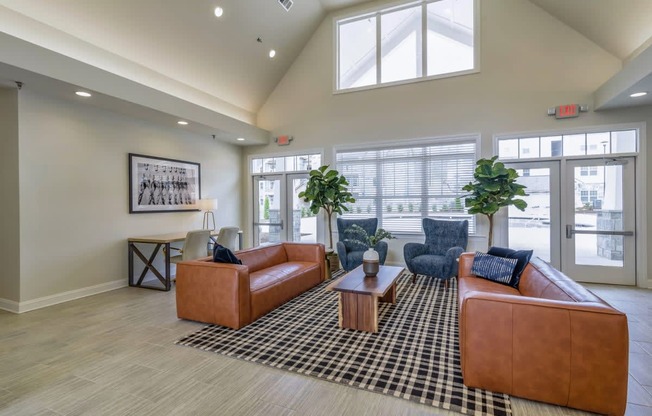 Ashland Farms Resident Clubhouse with Couch Seating, Modern Decor, and View of Pool Area
