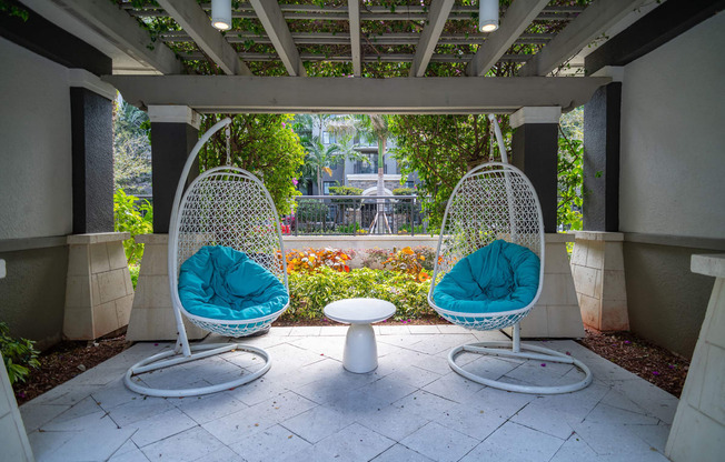 Two outdoor, hanging chair swings