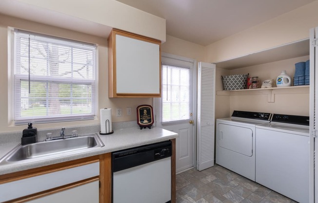 Kitchen with natural light and in-unit washer/dryer