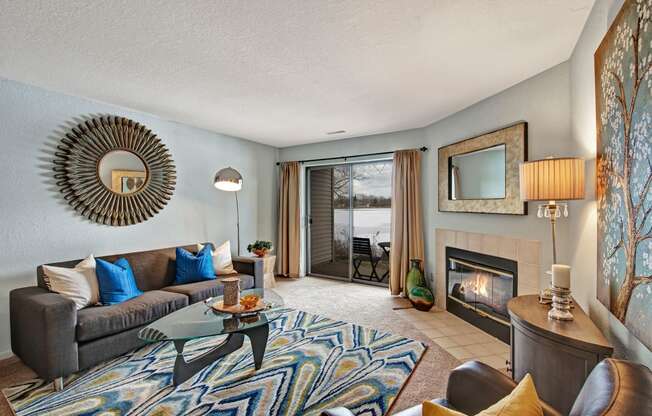 River's Cove living room with fireplaceoffer a living room with a fireplace