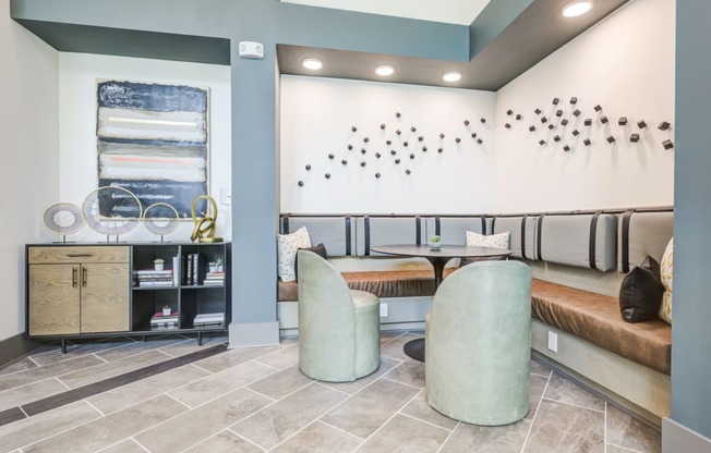 a seating area with two chairs and a tableat Century University City, Charlotte, 28213