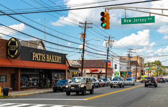 A street view with a bakery named Pattis Bakery on the corner. at Vermella Lyndhurst apartments, Lyndhurst, NJ, 07071