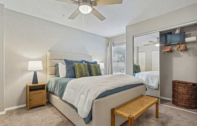 a bedroom with a large mirror and a ceiling fan at Reserve at Temple Terrace, Temple Terrace, FL 33637