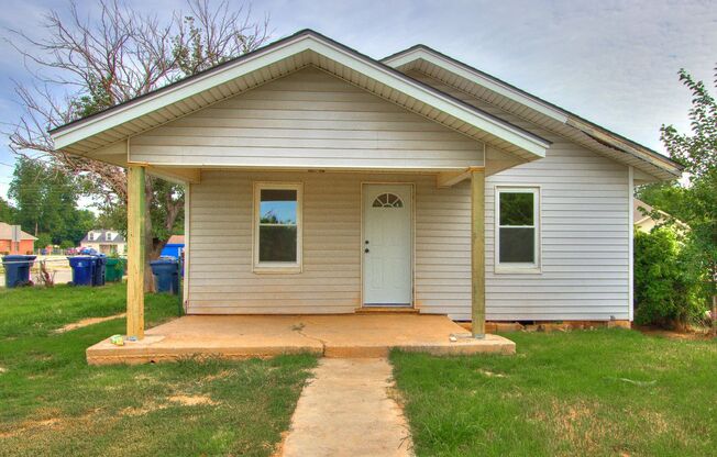 Stylishly Remodeled 2-Bedroom Home with Spacious Fenced Backyard and Gorgeous Green Kitchen Cabinets!