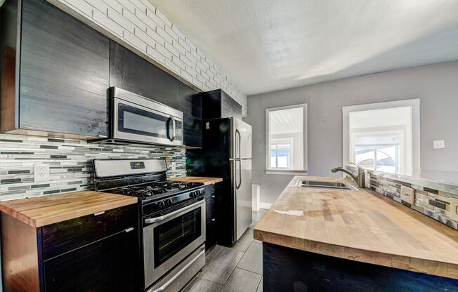 AVAILABLE NOW - 3 Bedroom Home w/ GARAGE! Ask how you can get up to one month of free rent!