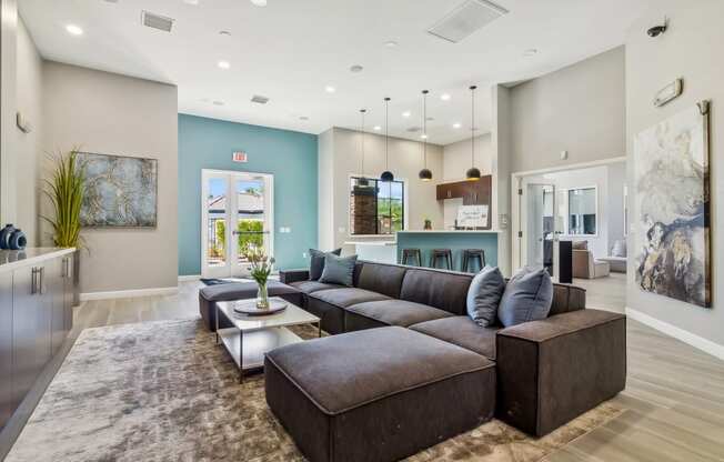 a living room with a large couch and a table