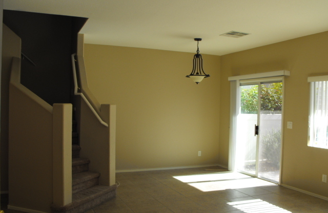 Spacious Henderson townhouse featuring   3 bedrooms PLUS 2 car garage.