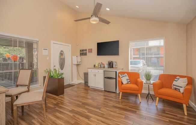 a living room filled with furniture and a large window