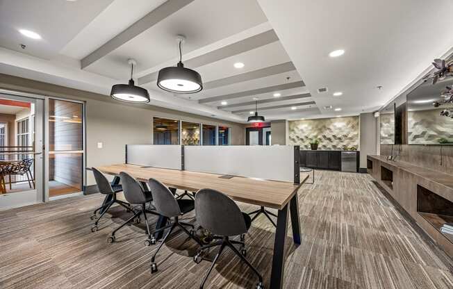 A conference room with a long table and chairs.