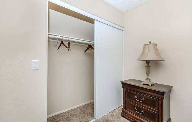 a bedroom with a bed and a mirror