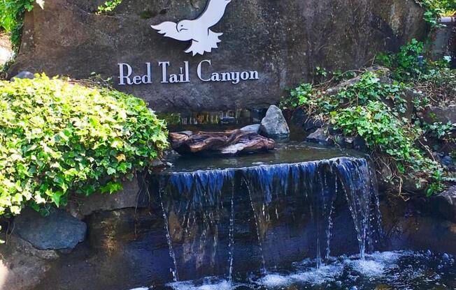 Red Tail Signage and Waterfall Feature