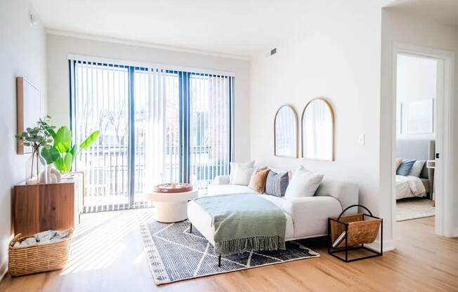 a living room with a couch and a bed