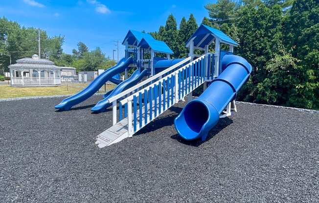 a playground with slides on a sunny day