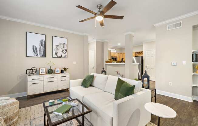 a living room with a white couch and a ceiling fan at The Verandah, Austin, 78726