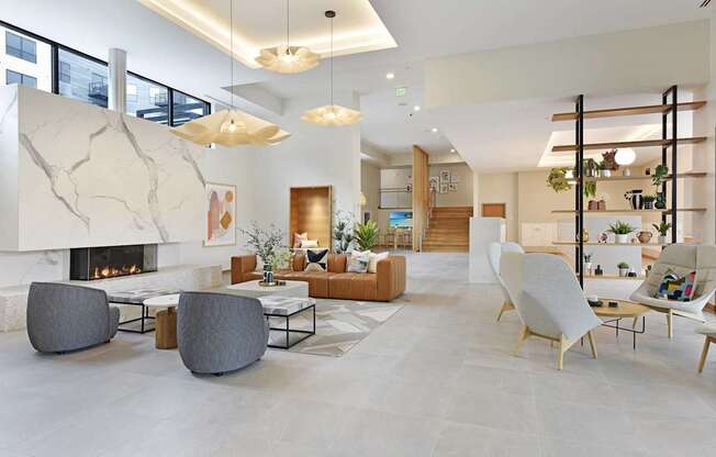 A modern living room with a fireplace and a variety of seating options.
