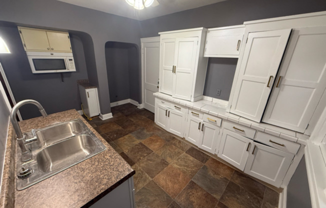 ✨ Updated 4BR/2BA Single-Family Home — Garage Parking, Water & Lawn Care Included ✨