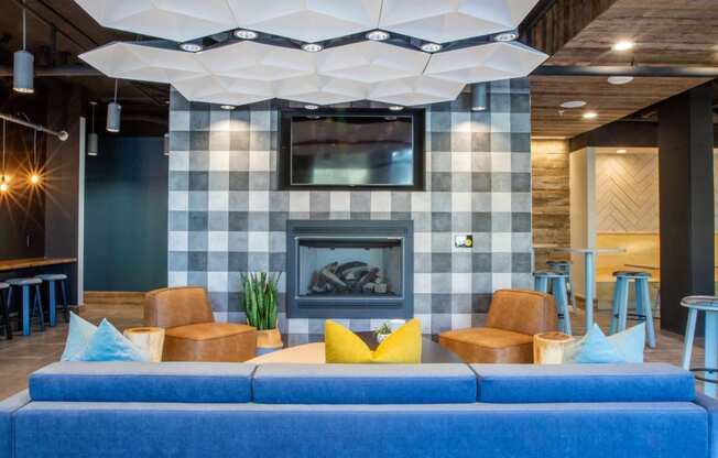 a living room with a blue couch and a fireplace at 511 Meeting, South Carolina, 29403