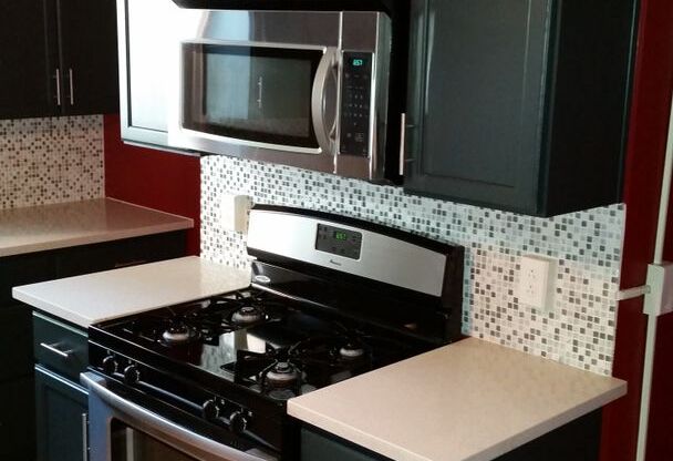 Modern 2 Bed/1 Bath row house with off-street parking!