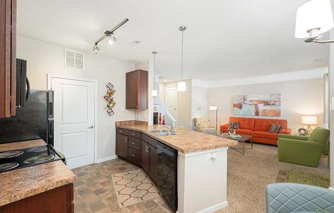 an open kitchen and living room with a counter top