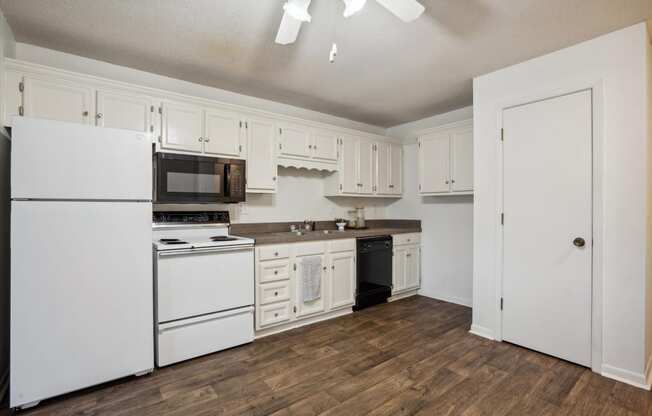 Fully Equipped Kitchen with White Appliances