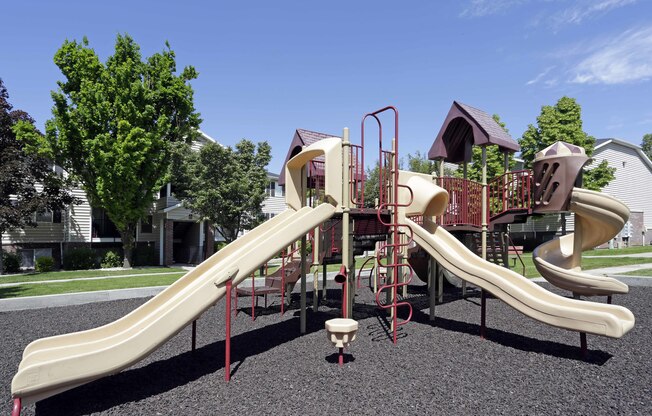 Playground with 4 slides and climbing structure