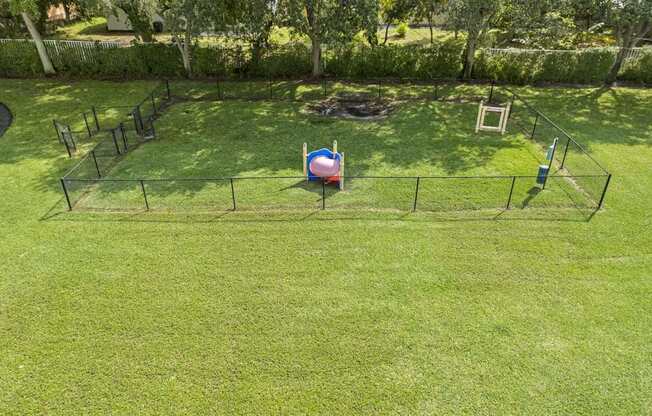a playground with a ball in the middle of a field